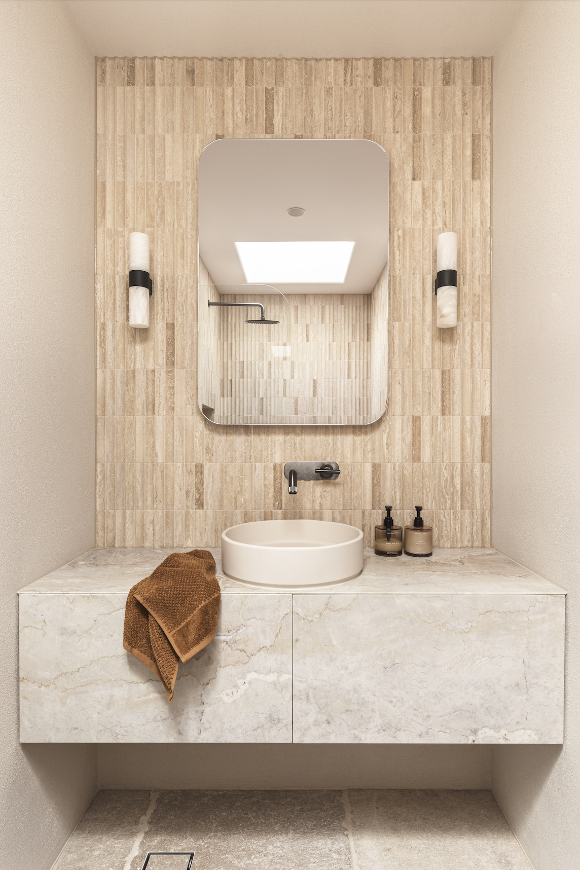A beautiful tiled bathroom vanity. 